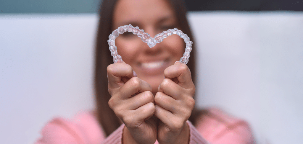 a typodont model with invisalign clear aligners